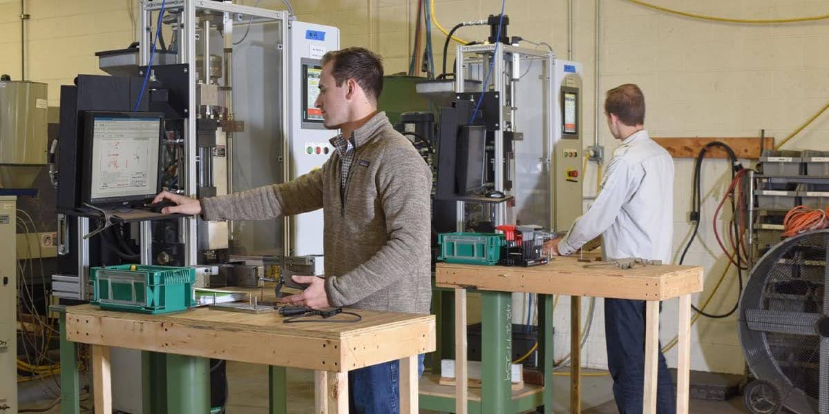 An engineer testing product standards in a manufacturing facility