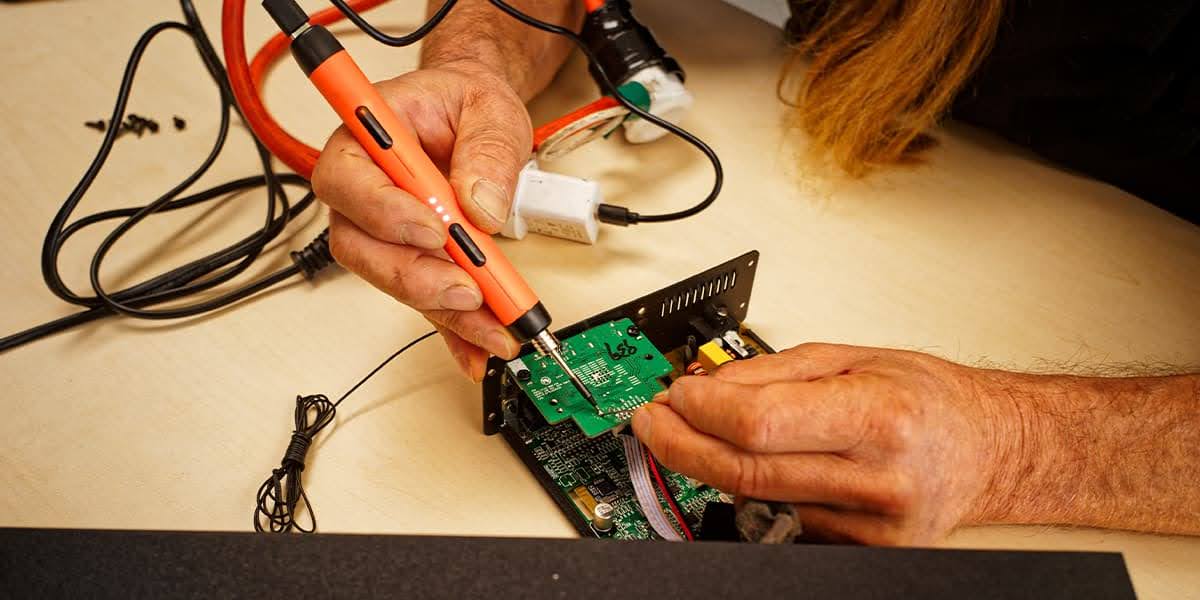 Engineers using CAD modeling to ensure products meet standards